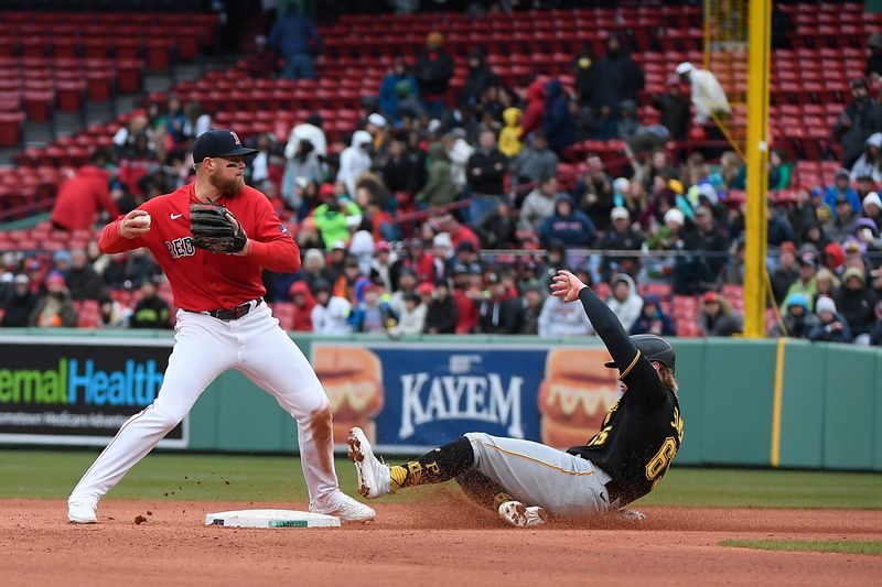 Apr 5, 2023; Boston, Massachusetts, USA; Boston Red Sox second baseman Christian Arroyo (39) tags out Pittsburgh Pirates center fielder Jack Suwinski (65) during the eighth inningat Fenway Park. Mandatory Credit: Eric Canha-USA TODAY Sports