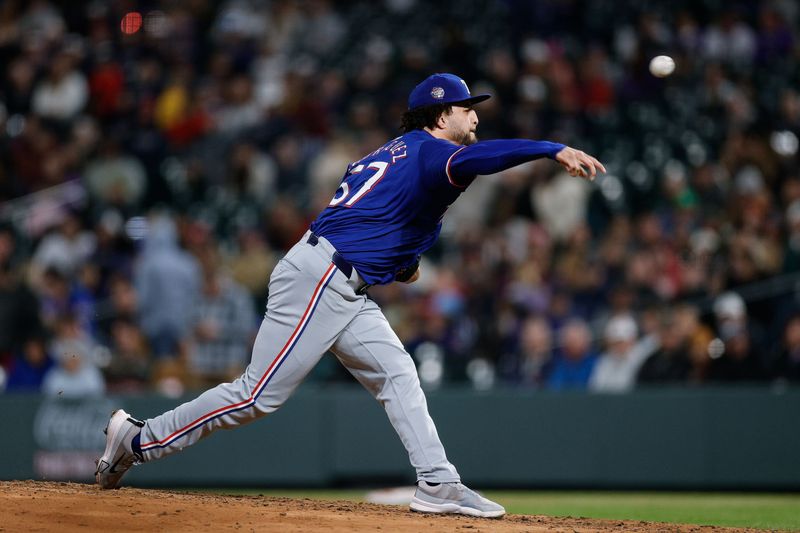 May 10, 2024; Denver, Colorado, USA; Texas Rangers relief pitcher Yerry Rodríguez (57) pitches in the eighth inning against the Colorado Rockies at Coors Field. Mandatory Credit: Isaiah J. Downing-USA TODAY Sports
