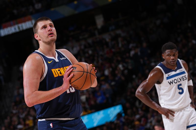 DENVER, CO - APRIL 10: Nikola Jokic #15 of the Denver Nuggets shoots a free throw during the game against the Minnesota Timberwolves on April 10, 2024 at the Ball Arena in Denver, Colorado. NOTE TO USER: User expressly acknowledges and agrees that, by downloading and/or using this Photograph, user is consenting to the terms and conditions of the Getty Images License Agreement. Mandatory Copyright Notice: Copyright 2024 NBAE (Photo by Bart Young/NBAE via Getty Images)