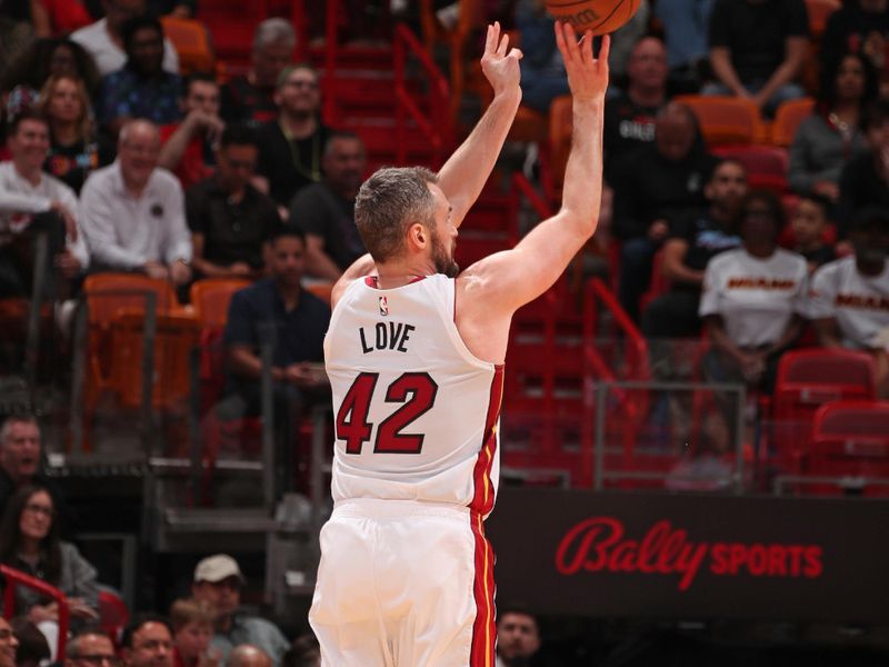 MIAMI, FL - APRIL 12: Kevin Love #42 of the Miami Heat shoots the ball during the game against the Toronto Raptors  on April 12, 2024 at Kaseya Center in Miami, Florida. NOTE TO USER: User expressly acknowledges and agrees that, by downloading and or using this Photograph, user is consenting to the terms and conditions of the Getty Images License Agreement. Mandatory Copyright Notice: Copyright 2024 NBAE (Photo by Issac Baldizon/NBAE via Getty Images)