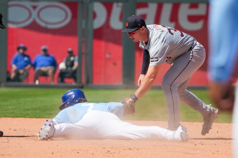 May 22, 2024; Kansas City, Missouri, USA; Detroit Tigers second baseman Colt Keith (33) canít make the tag as Kansas City Royals shortstop Bobby Witt Jr. (7) reaches second base on a double in the seventh inning at Kauffman Stadium. Mandatory Credit: Denny Medley-USA TODAY Sports