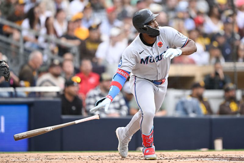 May 26, 2025; San Diego, California, USA;  Miami Marlins right fielder Jesus Sanchez (7) hits a solo home run during the second inning against the San Diego Padres at Petco Park. Mandatory Credit: Denis Poroy-Imagn Images