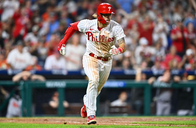 Jul 25, 2023; Philadelphia, Pennsylvania, USA; Philadelphia Phillies second baseman Bryson Stott (5) advances toward first after hitting an RBI double against the Baltimore Orioles in the ninth inning at Citizens Bank Park. Mandatory Credit: Kyle Ross-USA TODAY Sports