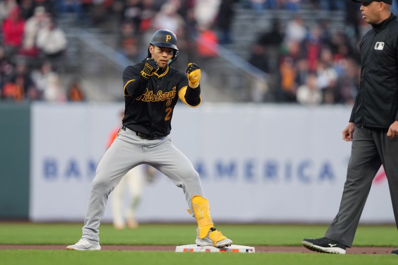 Apr 26, 2024; San Francisco, California, USA; Pittsburgh Pirates first baseman Connor Joe (2) gestures after hitting a double against the San Francisco Giants during the first inning at Oracle Park. Mandatory Credit: Darren Yamashita-USA TODAY Sports