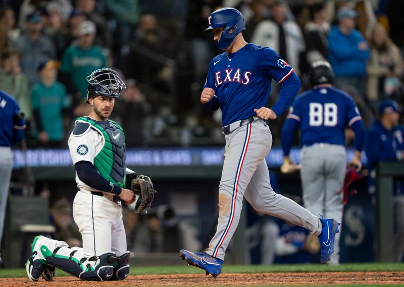 Jun 15, 2024; Seattle, Washington, USA; Texas Rangers left fielder Wyatt Langford (36) scores a run during the ninth inning against the Seattle Mariners at T-Mobile Park. Mandatory Credit: Stephen Brashear-USA TODAY Sports