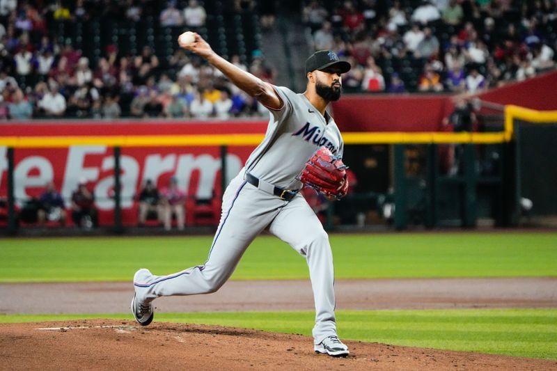 Jun 28, 2025; Phoenix, Arizona, USA; Miami Marlins starting pitcher Sandy Alcantara (22) delivers a pitch in the first inning against the Arizona Diamondbacks at Chase Field. Mandatory Credit: Arianna Grainey-Imagn Images