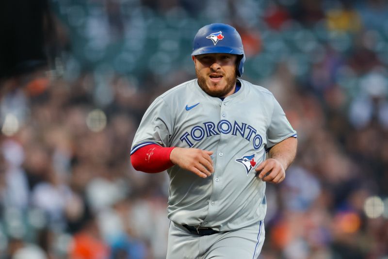 Jul 10, 2024; San Francisco, California, USA; Toronto Blue Jays catcher Alejandro Kirk (30) scores a run during the fifth inning against the San Francisco Giants at Oracle Park. Mandatory Credit: Sergio Estrada-USA TODAY Sports
