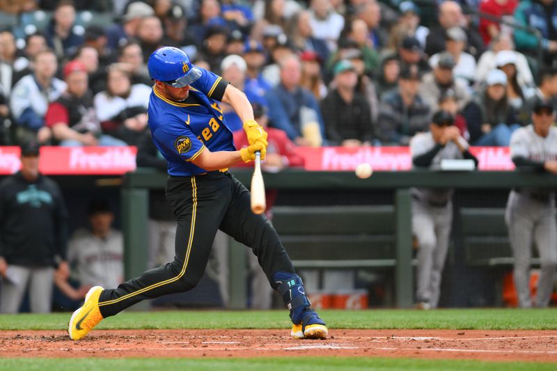 Apr 26, 2024; Seattle, Washington, USA; Seattle Mariners designated hitter Mitch Garver (18) hits a home run against the Arizona Diamondbacks during the second inning at T-Mobile Park. Mandatory Credit: Steven Bisig-USA TODAY Sports