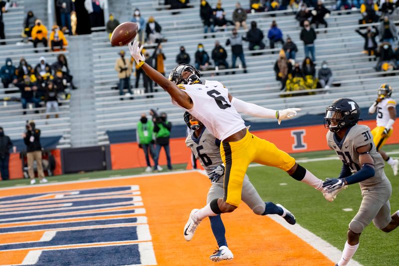 Dec 5, 2020; Champaign, Illinois, USA; Iowa Hawkeyes wide receiver Ihmir Smith-Marsette (6) is unable to pull in a pass in the end zone against Illinois Fighting Illini defensive back Devon Witherspoon (31) during the first half at Memorial Stadium. Mandatory Credit: Patrick Gorski-USA TODAY Sports