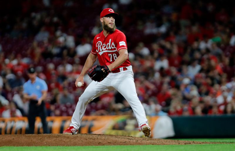 Aug 16, 2023; Cincinnati, Ohio, USA; Cincinnati Reds relief pitcher Alan Busenitz (78) looks to throw against the Cleveland Guardians during the ninth inning at Great American Ball Park. Mandatory Credit: David Kohl-USA TODAY Sports