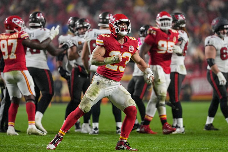 Kansas City Chiefs linebacker Drue Tranquill (23) celebrates a defensive play against the Tampa Bay Buccaneers during the second half of an NFL football game, Monday, Nov. 4, 2024, in Kansas City, Mo. (AP Photo/Ed Zurga)