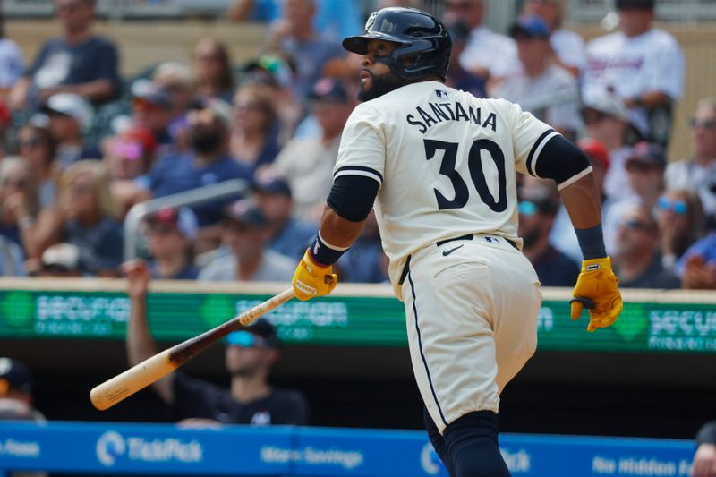 Aug 14, 2024; Minneapolis, Minnesota, USA; Minnesota Twins first baseman Carlos Santana (30) runs the bases after hitting a solo home run against the Kansas City Royals in the fourth inning at Target Field. Mandatory Credit: Bruce Kluckhohn-USA TODAY Sports