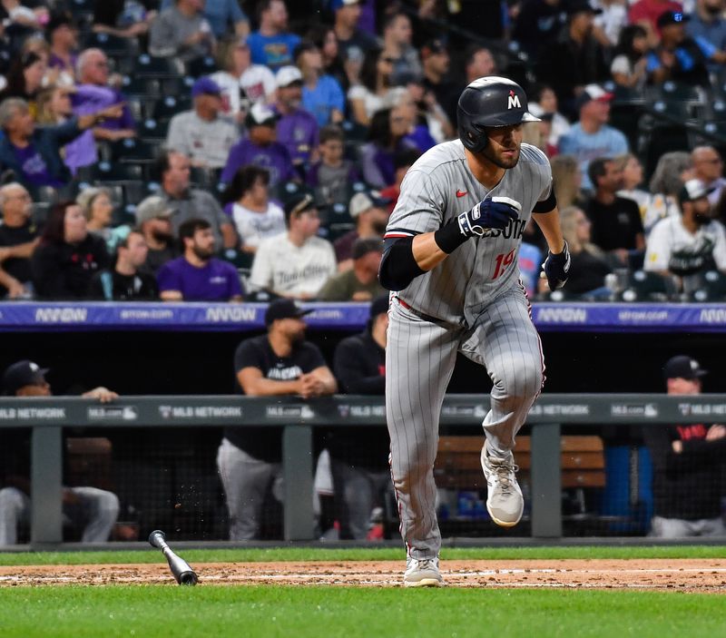 Sep 30, 2023; Denver, Colorado, USA; Minnesota Twins first baseman Alex Kirilloff (19) hits a ground-rule double in the third inning against the Colorado Rockies at Coors Field. Mandatory Credit: John Leyba-USA TODAY Sports