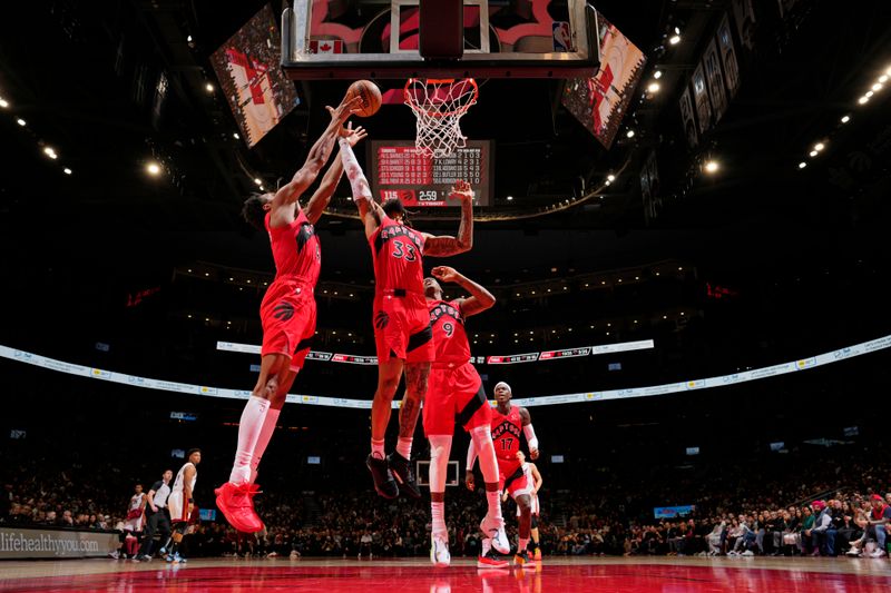 TORONTO, CANADA - JANUARY 17: Gary Trent Jr. #33 of the Toronto Raptors rebounds the ball during the game against the Miami Heat on January 17, 2024 at the Scotiabank Arena in Toronto, Ontario, Canada.  NOTE TO USER: User expressly acknowledges and agrees that, by downloading and or using this Photograph, user is consenting to the terms and conditions of the Getty Images License Agreement.  Mandatory Copyright Notice: Copyright 2024 NBAE (Photo by Mark Blinch/NBAE via Getty Images)