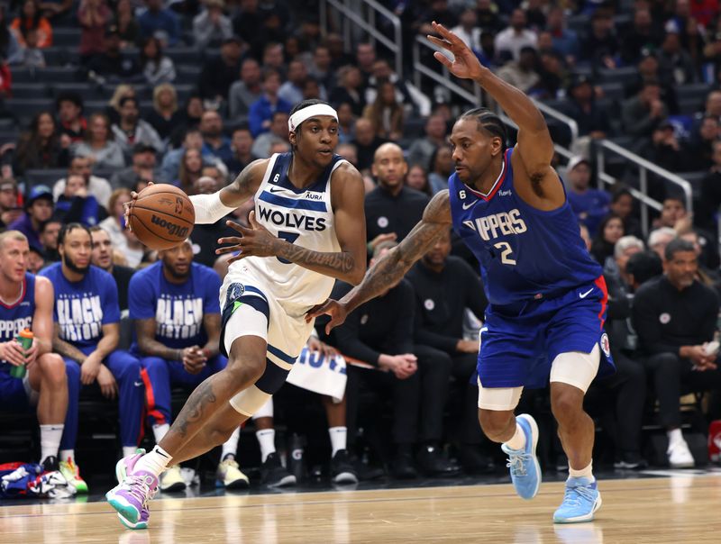 LOS ANGELES, CALIFORNIA - FEBRUARY 28: Jaden McDaniels #3 of the Minnesota Timberwolves drives to the basket on Kawhi Leonard #2 of the LA Clippers during a 108-101 Timberwolves win at Crypto.com Arena on February 28, 2023 in Los Angeles, California. NOTE TO USER: User expressly acknowledges and agrees that, by downloading and or using this photograph, user is consenting to the terms and conditions of the Getty Images License Agreement. (Photo by Harry How/Getty Images)