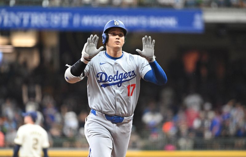 Aug 12, 2024; Milwaukee, Wisconsin, USA; Los Angeles Dodgers two-way player Shohei Ohtani (17) rounds the bases after hitting a home run agains the Milwaukee Brewers in the fifth inning at American Family Field. Mandatory Credit: Michael McLoone-USA TODAY Sports