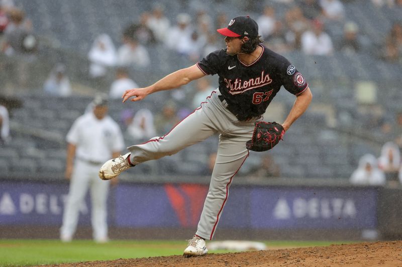 Aug 24, 2023; Bronx, New York, USA; Washington Nationals relief pitcher Kyle Finnegan (67) follows through on a pitch against the New York Yankees during the ninth inning at Yankee Stadium. Mandatory Credit: Brad Penner-USA TODAY Sports