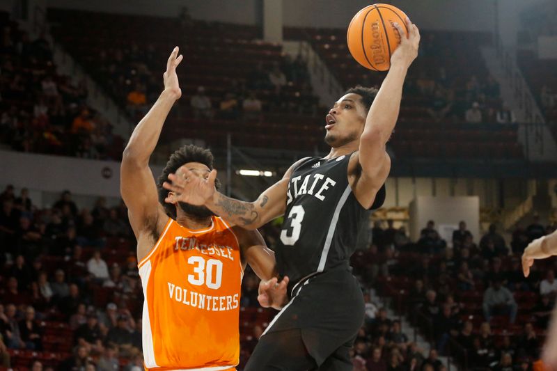 Jan 17, 2023; Starkville, Mississippi, USA; Mississippi State Bulldogs guard Shakeel Moore (3) drives to the basket as Tennessee Volunteers guard Josiah-Jordan James (30) defends during the second half at Humphrey Coliseum. Mandatory Credit: Petre Thomas-USA TODAY Sports