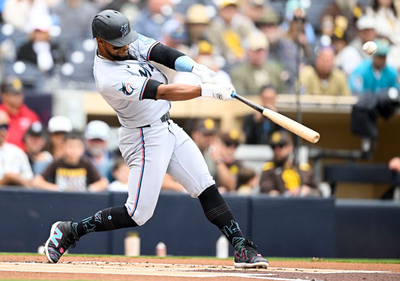 May 28, 2025; San Diego, California, USA; Miami Marlins second baseman Otto Lopez (6) hits a single during the first inning against the San Diego Padres at Petco Park. Mandatory Credit: Denis Poroy-Imagn Images