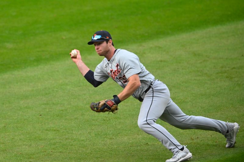 Oct 12, 2024; Cleveland, Ohio, USA; Detroit Tigers second base Colt Keith (33) throws to first base in the seventh inning against the Cleveland Guardians during game five of the ALDS for the 2024 MLB Playoffs at Progressive Field. Mandatory Credit: David Richard-Imagn Images