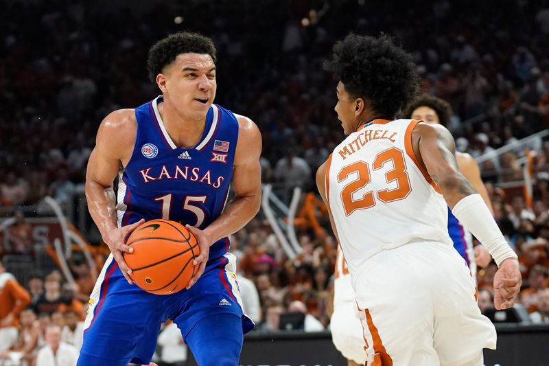 Mar 4, 2023; Austin, Texas, USA; Kansas Jayhawks guard Kevin McCullar Jr. (15) drives to the basket against Texas Longhorns forward Dillon Mitchell (23) during the second half at Moody Center. Mandatory Credit: Scott Wachter-USA TODAY Sports