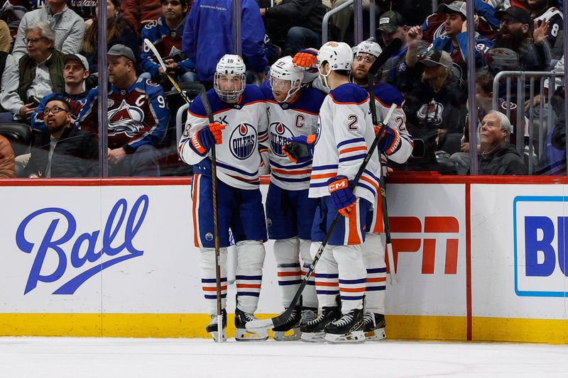 Jan 16, 2025; Denver, Colorado, USA; Edmonton Oilers center Connor McDavid (97) celebrates his goal with left wing Zach Hyman (18) and center Leon Draisaitl (29) and defenseman Evan Bouchard (2) in the second period against the Colorado Avalanche at Ball Arena. Mandatory Credit: Isaiah J. Downing-Imagn Images