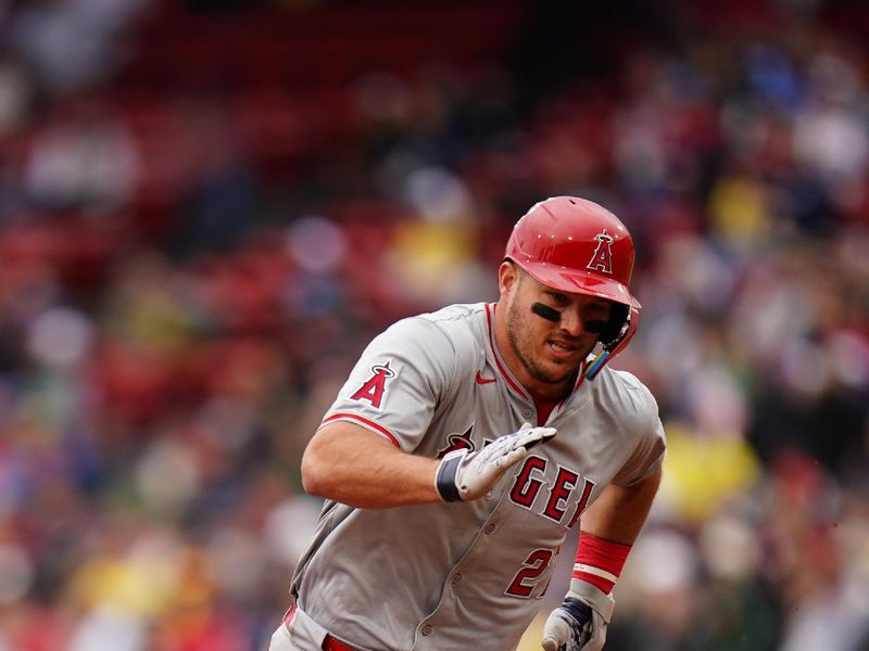 Apr 14, 2024; Boston, Massachusetts, USA; Los Angeles Angels center fielder Mike Trout (27) hits a triple against the Boston Red Sox in the eighth inning at Fenway Park. Mandatory Credit: David Butler II-USA TODAY Sports