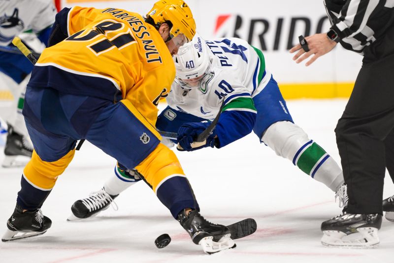 Jan 29, 2025; Nashville, Tennessee, USA;  Nashville Predators center Jonathan Marchessault (81) and Vancouver Canucks center Elias Pettersson (40) face off during the first period at Bridgestone Arena. Mandatory Credit: Steve Roberts-Imagn Images