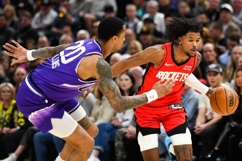 SALT LAKE CITY, UTAH - MARCH 29: Jalen Green #4 of the Houston Rockets drives past John Collins #20 of the Utah Jazz during the first half of a game at Delta Center on March 29, 2024 in Salt Lake City, Utah. NOTE TO USER: User expressly acknowledges and agrees that, by downloading and or using this photograph, User is consenting to the terms and conditions of the Getty Images License Agreement.  (Photo by Alex Goodlett/Getty Images)