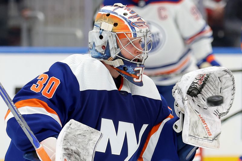 Dec 19, 2023; Elmont, New York, USA; New York Islanders goaltender Ilya Sorokin (30) makes a save against the Edmonton Oilers during the third period at UBS Arena. Mandatory Credit: Brad Penner-USA TODAY Sports