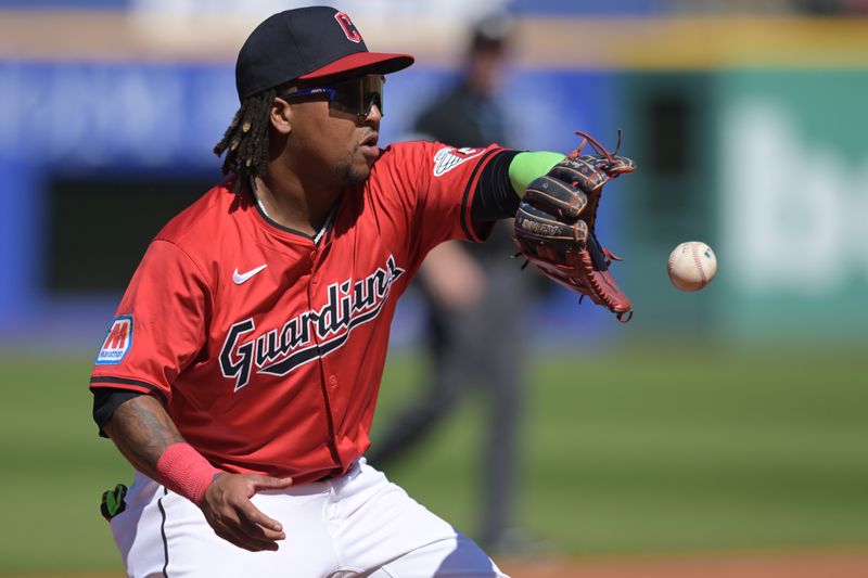 Sep 19, 2024; Cleveland, Ohio, USA; Cleveland Guardians third baseman Jose Ramirez (11) fields a ball hit by Minnesota Twins first baseman Carlos Santana (not pictured) during the fourth inning at Progressive Field. Mandatory Credit: Ken Blaze-Imagn Images