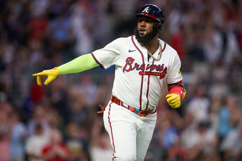 May 28, 2024; Atlanta, Georgia, USA; Atlanta Braves designated hitter Marcell Ozuna (20) celebrates after a home run against the Washington Nationals in the seventh inning at Truist Park. Mandatory Credit: Brett Davis-USA TODAY Sports