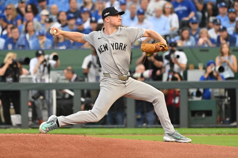 Oct 9, 2024; Kansas City, Missouri, USA; New York Yankees starting pitcher Clarke Schmidt (36) pitches in the first inning against the Kansas City Royals during game three of the NLDS for the 2024 MLB Playoffs at Kauffman Stadium. Mandatory Credit: Peter Aiken-Imagn Images