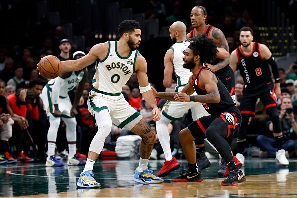 Boston, MA - November 28: Boston Celtics SF Jayson Tatum is defended by Chicago Bulls PG Coby White in the first quarter. The Celtics beat the Bulls, 124-97. (Photo by Danielle Parhizkaran/The Boston Globe via Getty Images)