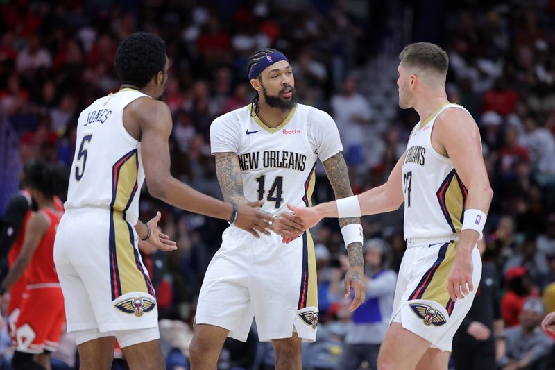 NEW ORLEANS, LOUISIANA - FEBRUARY 25: Brandon Ingram #14, Matt Ryan #37 and Herbert Jones #5 of the New Orleans Pelicans react against the Chicago Bulls during the first half at the Smoothie King Center on February 25, 2024 in New Orleans, Louisiana. NOTE TO USER: User expressly acknowledges and agrees that, by downloading and or using this Photograph, user is consenting to the terms and conditions of the Getty Images License Agreement. (Photo by Jonathan Bachman/Getty Images)