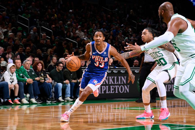 BOSTON, MA - OCTOBER 12: Judah Mintz #33 of the Philadelphia 76ers handles the ball during the game against the Boston Celtics during a NBA Preseason game on October 12, 2024 at TD Garden in Boston, Massachusetts. NOTE TO USER: User expressly acknowledges and agrees that, by downloading and/or using this Photograph, user is consenting to the terms and conditions of the Getty Images License Agreement. Mandatory Copyright Notice: Copyright 2024 NBAE (Photo by Brian Babineau/NBAE via Getty Images)