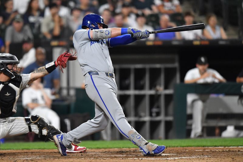 Jul 30, 2024; Chicago, Illinois, USA; Kansas City Royals first base Vinnie Pasquantino (9) hits a two-run single during the eighth inning against the Chicago White Sox at Guaranteed Rate Field. Mandatory Credit: Patrick Gorski-USA TODAY Sports