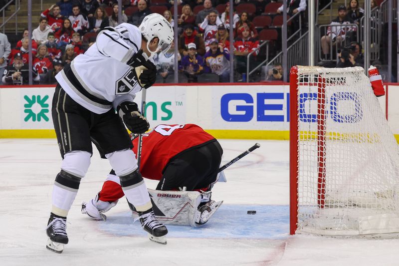 Feb 23, 2023; Newark, New Jersey, USA; Los Angeles Kings center Anze Kopitar (11) scores a goal on New Jersey Devils goaltender Vitek Vanecek (41) during the first period at Prudential Center. Mandatory Credit: Ed Mulholland-USA TODAY Sports