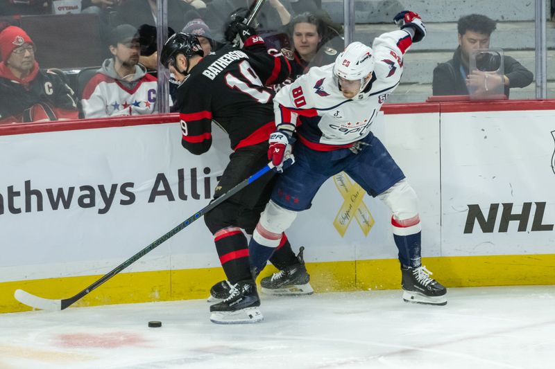 Jan 30, 2025; Ottawa, Ontario, CAN; Ottawa Senators right wing Drake Batherson (19) battles with Washington Capitals left wing Pierrre-Luc Dubois (80) in the third period at the Canadian Tire Centre. Mandatory Credit: Marc DesRosiers-Imagn Images