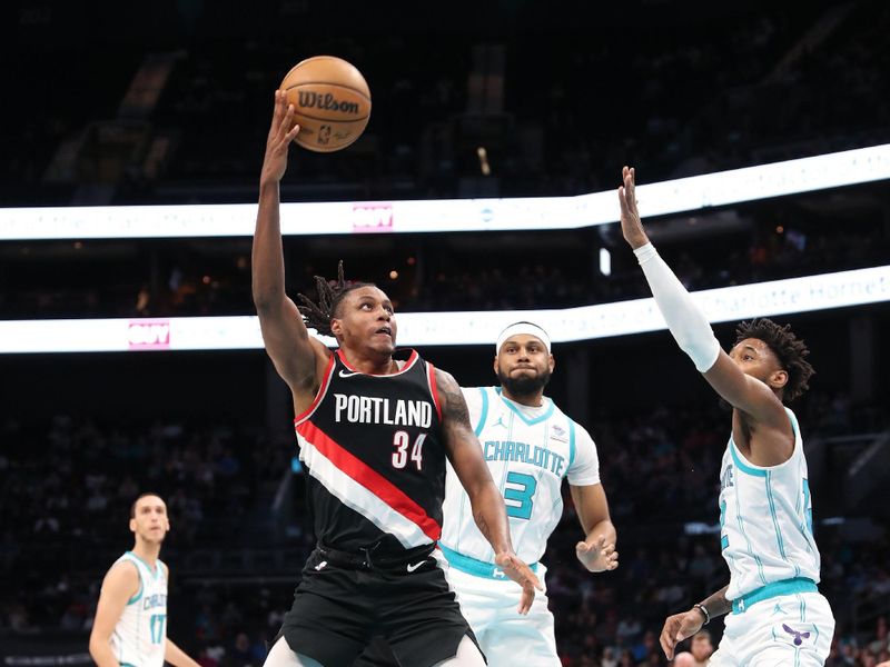 CHARLOTTE, NC - APRIL 3:  Jabari Walker #34 of the Portland Trail Blazers drives to the basket during the game against the Charlotte Hornets on April 3, 2024 at Spectrum Center in Charlotte, North Carolina. NOTE TO USER: User expressly acknowledges and agrees that, by downloading and or using this photograph, User is consenting to the terms and conditions of the Getty Images License Agreement.  Mandatory Copyright Notice:  Copyright 2024 NBAE (Photo by Brock Williams-Smith/NBAE via Getty Images)