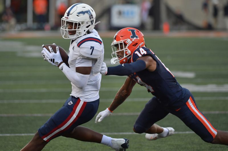 Sep 23, 2023; Champaign, Illinois, USA;  Florida Atlantic Owls wide receiver Devin Price (7) makes a reception in front of Illinois Fighting Illini defensive back Xavier Scott (14) during the second half at Memorial Stadium. Mandatory Credit: Ron Johnson-USA TODAY Sports