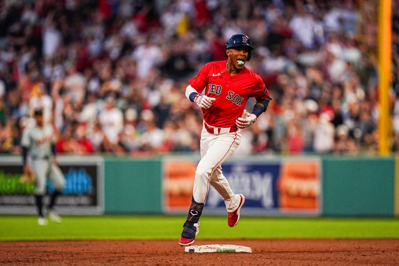 May 31, 2024; Boston, Massachusetts, USA; Boston Red Sox center fielder Ceddanne Rafaela (43) hits a three run home run against the Detroit Tigers in the fourth inning at Fenway Park. Mandatory Credit: David Butler II-USA TODAY Sports