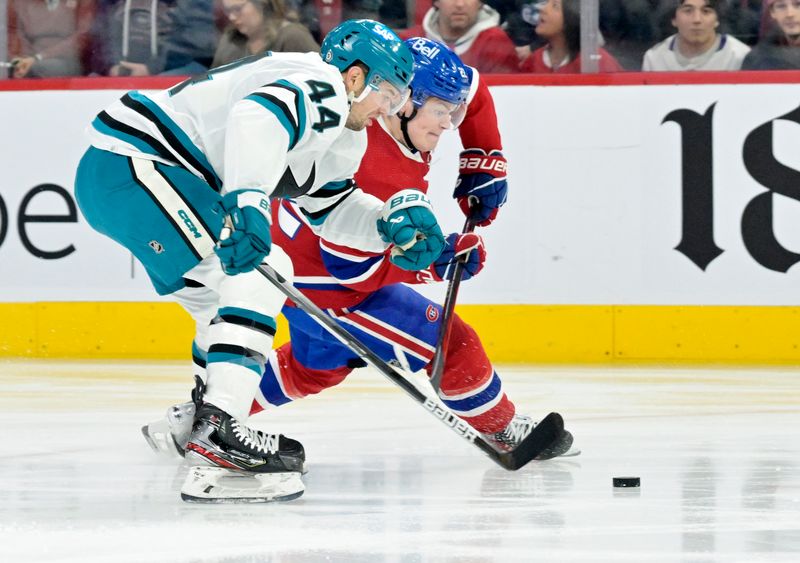 Jan 11, 2024; Montreal, Quebec, CAN; San Jose Sharks defenseman Marc-Edouard Vlasic (44) checks Montreal Canadiens forward Cole Caufield (22) during the first period at the Bell Centre. Mandatory Credit: Eric Bolte-USA TODAY Sports