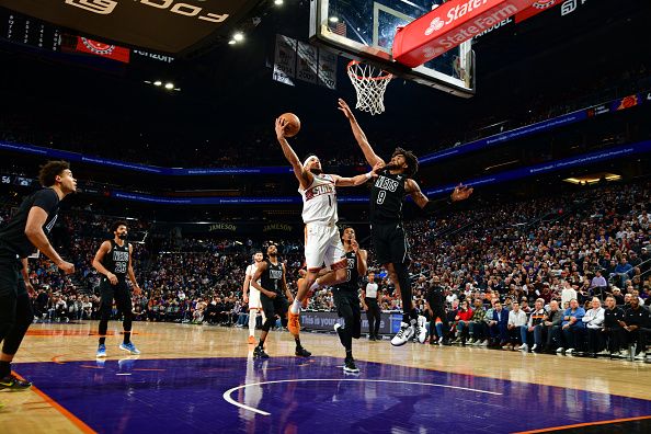 PHOENIX, AZ -DECEMBER 13: Devin Booker #1 of the Phoenix Suns drives to the basket during the game against the Brooklyn Nets on December 13, 2023 at Footprint Center in Phoenix, Arizona. NOTE TO USER: User expressly acknowledges and agrees that, by downloading and or using this photograph, user is consenting to the terms and conditions of the Getty Images License Agreement. Mandatory Copyright Notice: Copyright 2023 NBAE (Photo by Kate Frese/NBAE via Getty Images)