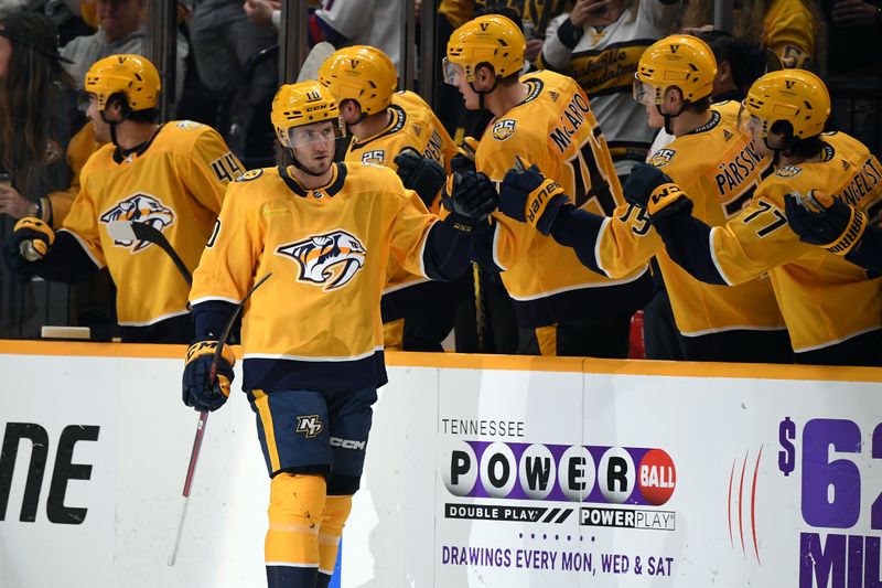 Dec 23, 2023; Nashville, Tennessee, USA; Nashville Predators center Colton Sissons (10) is congratulated by teammates after a goal during the second period against the Dallas Stars at Bridgestone Arena. Mandatory Credit: Christopher Hanewinckel-USA TODAY Sports