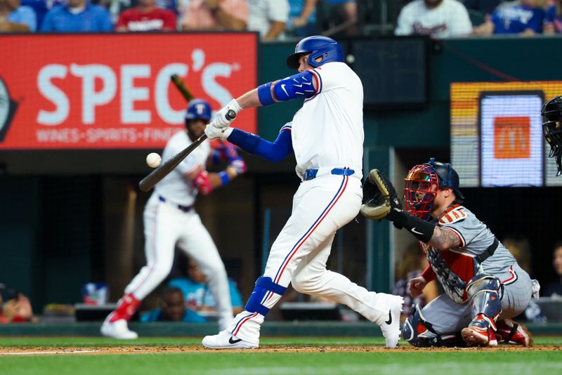 Aug 17, 2024; Arlington, Texas, USA;  Texas Rangers designated hitter Carson Kelly (18) hits an rbi single during the second inning against the Minnesota Twins at Globe Life Field. Mandatory Credit: Kevin Jairaj-USA TODAY Sports