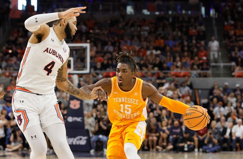 Mar 4, 2023; Auburn, Alabama, USA;  Tennessee Volunteers guard Jahmai Mashack (15) drives to the basket against Auburn Tigers forward Johni Broome (4) during the first half at Neville Arena. Mandatory Credit: John Reed-USA TODAY Sports