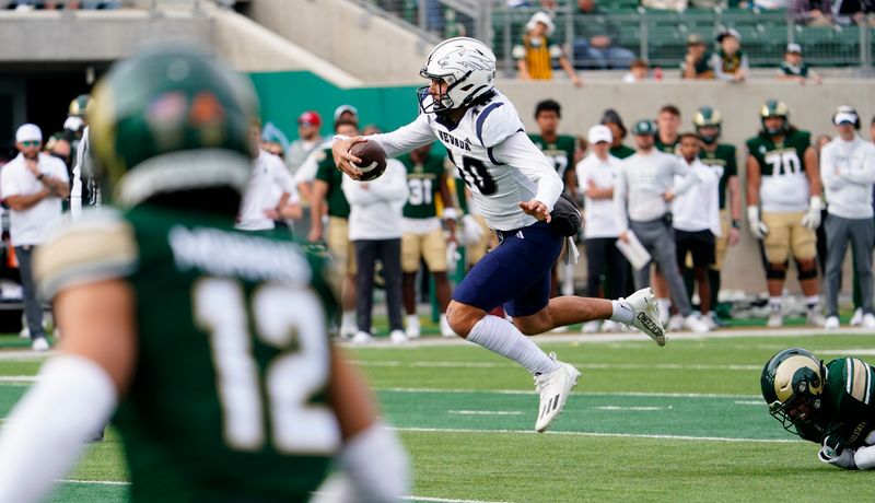 Nov 18, 2023; Fort Collins, Colorado, USA;  Nevada Wolf Pack quarterback AJ Bianco (10) scrambles out of the pocket in the1 at Sonny Lubick Field at Canvas Stadium. Mandatory Credit: Michael Madrid-USA TODAY Sports