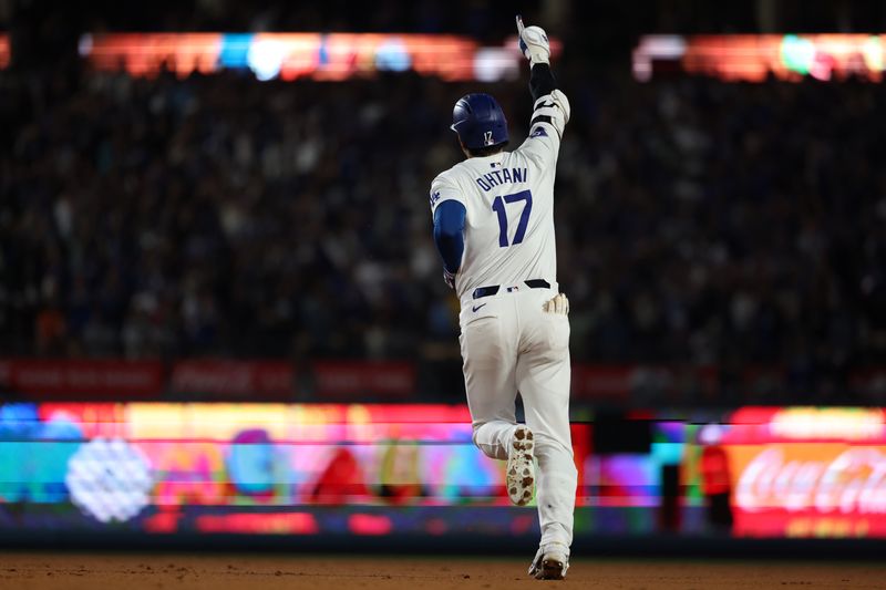 Jul 2, 2024; Los Angeles, California, USA;  Los Angeles Dodgers designated hitter Shohei Ohtani (17) reacts after hitting a two-run home run during the seventh inning against the Arizona Diamondbacks at Dodger Stadium. Mandatory Credit: Kiyoshi Mio-USA TODAY Sports