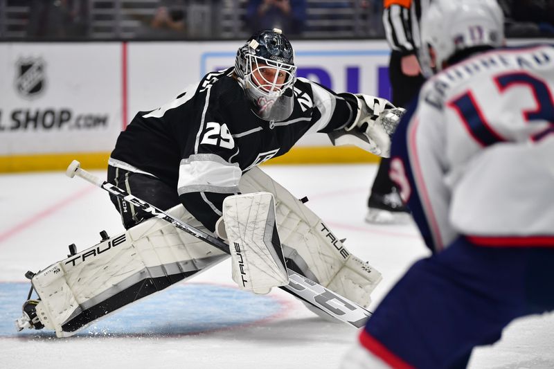 Mar 16, 2023; Los Angeles, California, USA; Los Angeles Kings goaltender Pheonix Copley (29) defends the goal against Columbus Blue Jackets left wing Johnny Gaudreau (13) during the first period at Crypto.com Arena. Mandatory Credit: Gary A. Vasquez-USA TODAY Sports